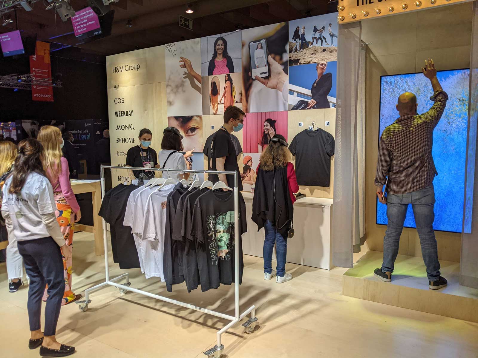 people at staged retail booth